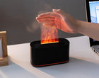 Hand held directly in the SnugGlow flame, showing it is cool mist and light
